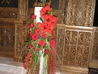 νυφική λαμπάδα με κόκκινες αμαρυλλίδες και κόκκινα τριαντάφυλλα